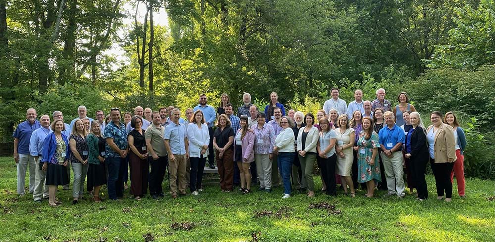 Group photo of the 2023 Ocean Life Forum event attendees taken on the Smithsonian Environmental Research Center (SERC) campus.