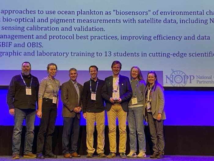Conveners and members of the Bio-GO-SHIP team at the NOPP Excellence in Partnering Award Ceremony (L-R): team members Jason Graff (OSU), Harriet Alexander (WHOI); convener Steve Thur (NOAA); team members Luke Thompson (NGI/AOML), Adam Martiny (UCI), Sophie Clayton (National Oceanography Centre), and Nicole Poulton (Bigelow Laboratory). 